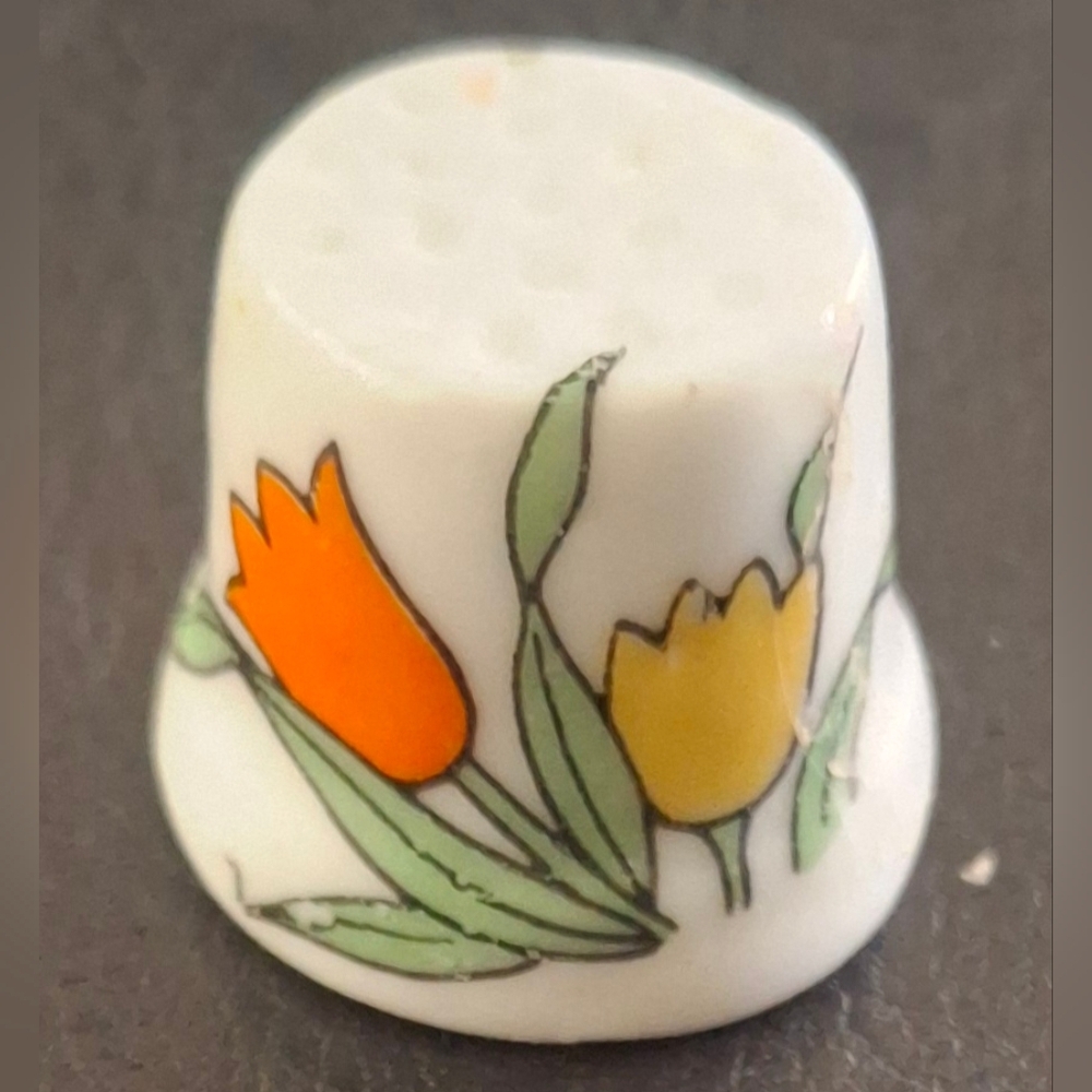 Vintage Porcelain floral painted dimple top thimble.